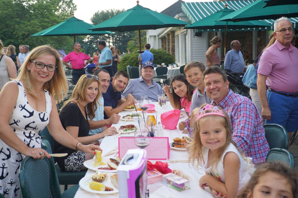 Family celebration around a decorated table at Shuttle Meadow